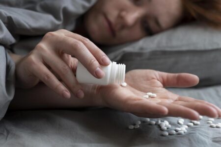 close-up-depressed-woman-with-pills